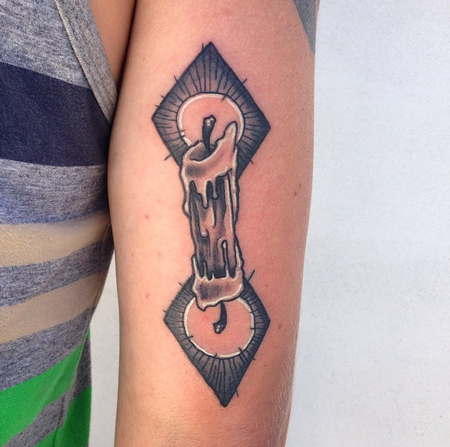 Cody Cook - black and grey double sided burning candle arm tattoo